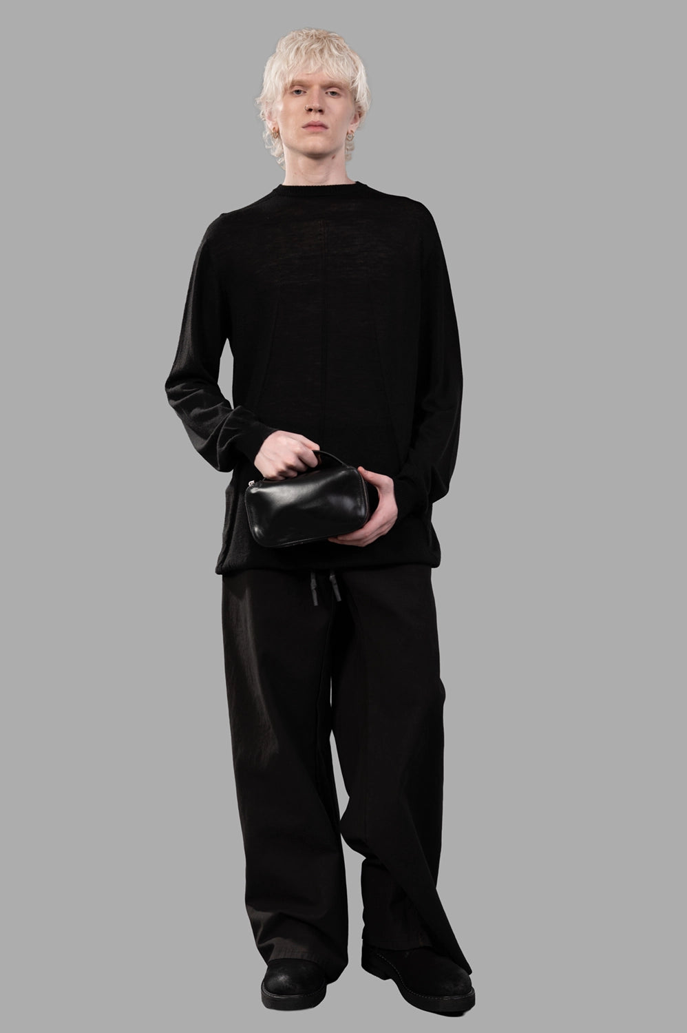 69 by Isaac Sellam trousers in noir, on-model full length, wide-leg silhouette with stacked hem