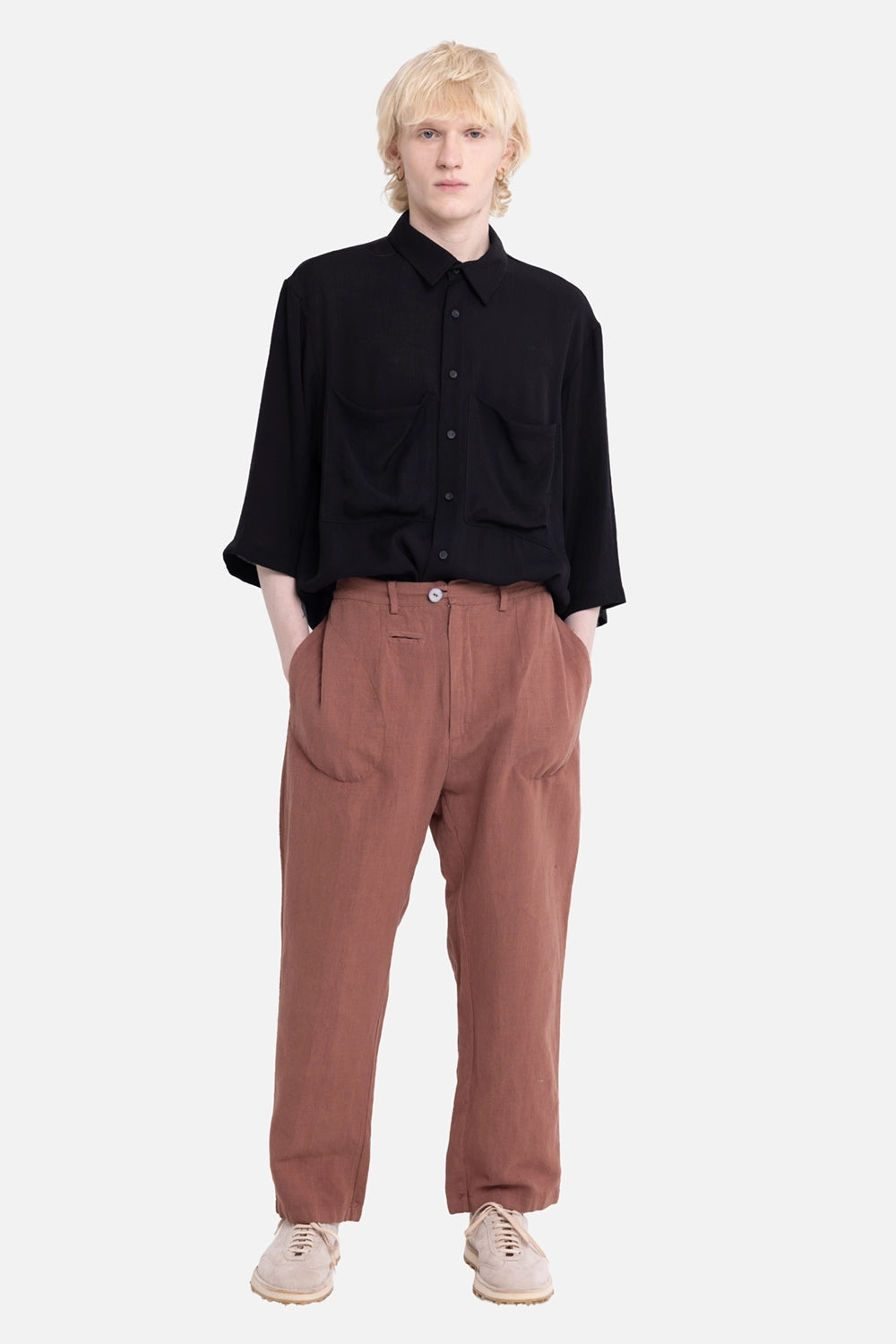 Vuscichè men's trousers in rust, on-model full-length, natural button and curved front pockets