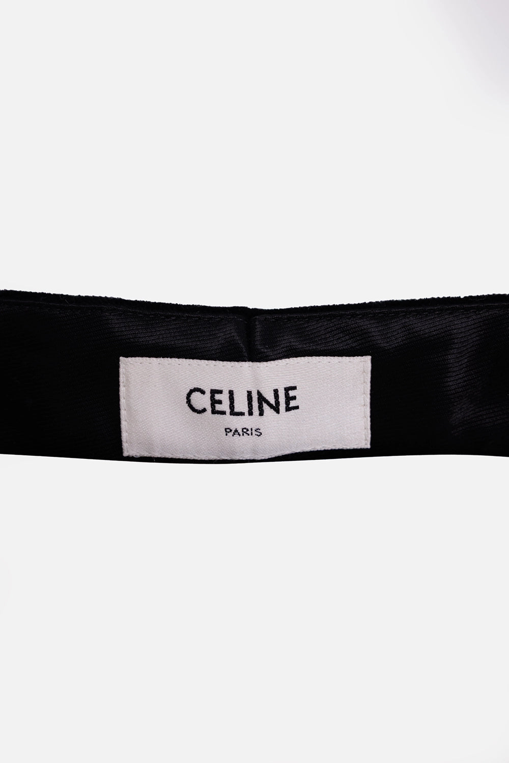Celine women's velvet cropped trousers in black, label detail with white brand tag and satin waistband