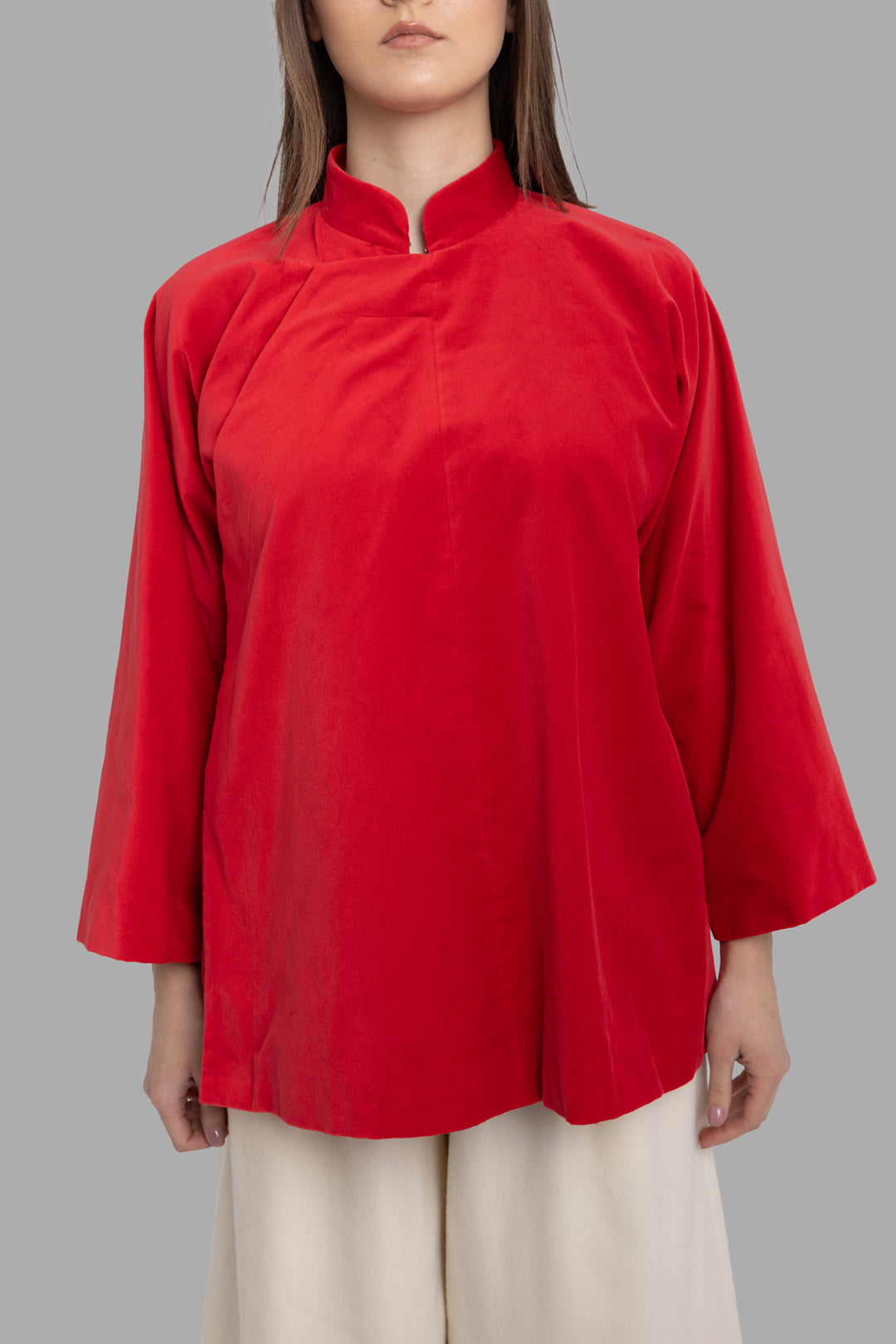 Comme des Garçons women's red velvet jacket, front view with mandarin collar and relaxed A-line fit.