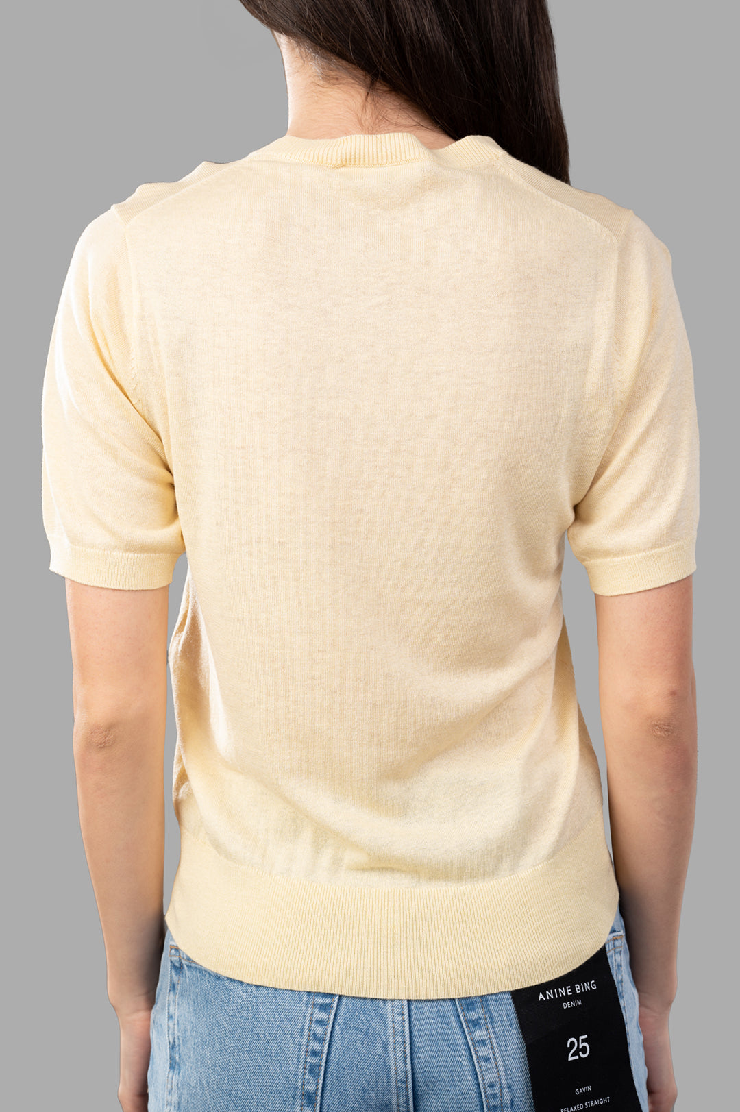 By Malene Birger Lelle Sweater shown from the back, featuring a soft wool blend and short sleeves in a Sea Mist hue.