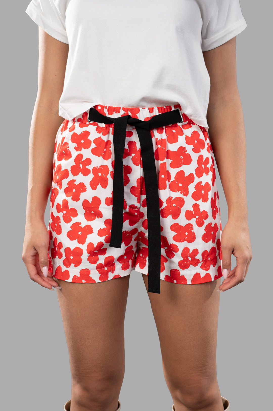 MSGM Floral-print Shorts in coral and white, featuring drawstring fastening, on-model, showing comfortable fit and style.