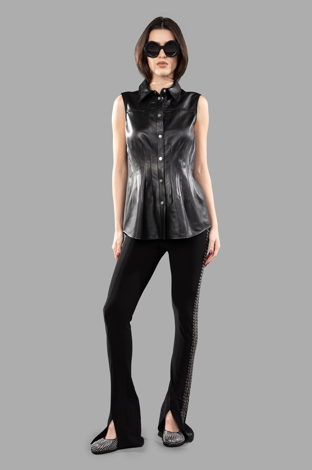Helmut Lang Darted Shirt in black leather, sleeveless design, front view showcasing classic collar and press-stud closure.