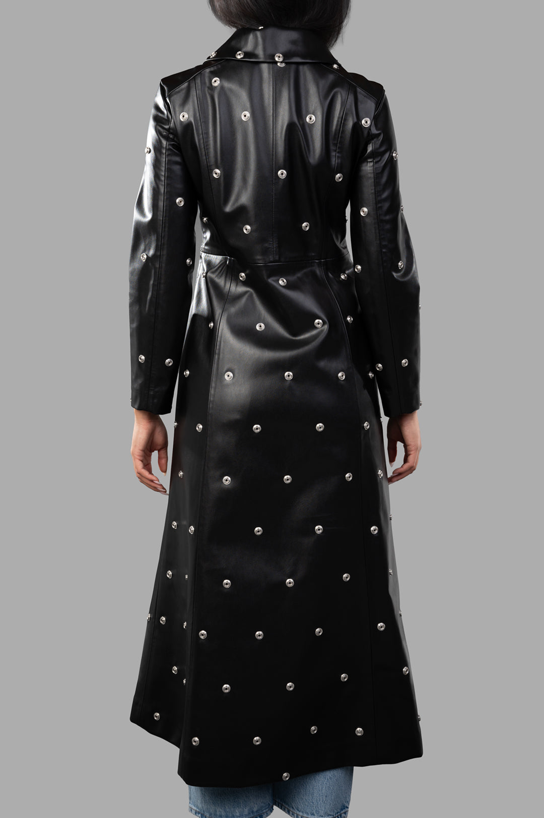 A.W.A.K.E. MODE Faux Leather Studded Coat displayed from the back, showcasing its fitted bodice and statement studs.