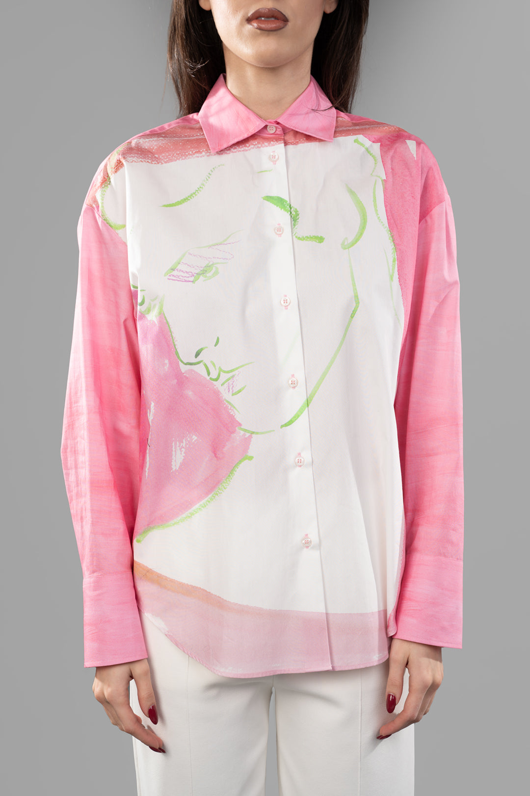 MSGM Fluid Print Shirt featuring a colorful "FACE" graphic, styled on a model with a soft pink and white design.