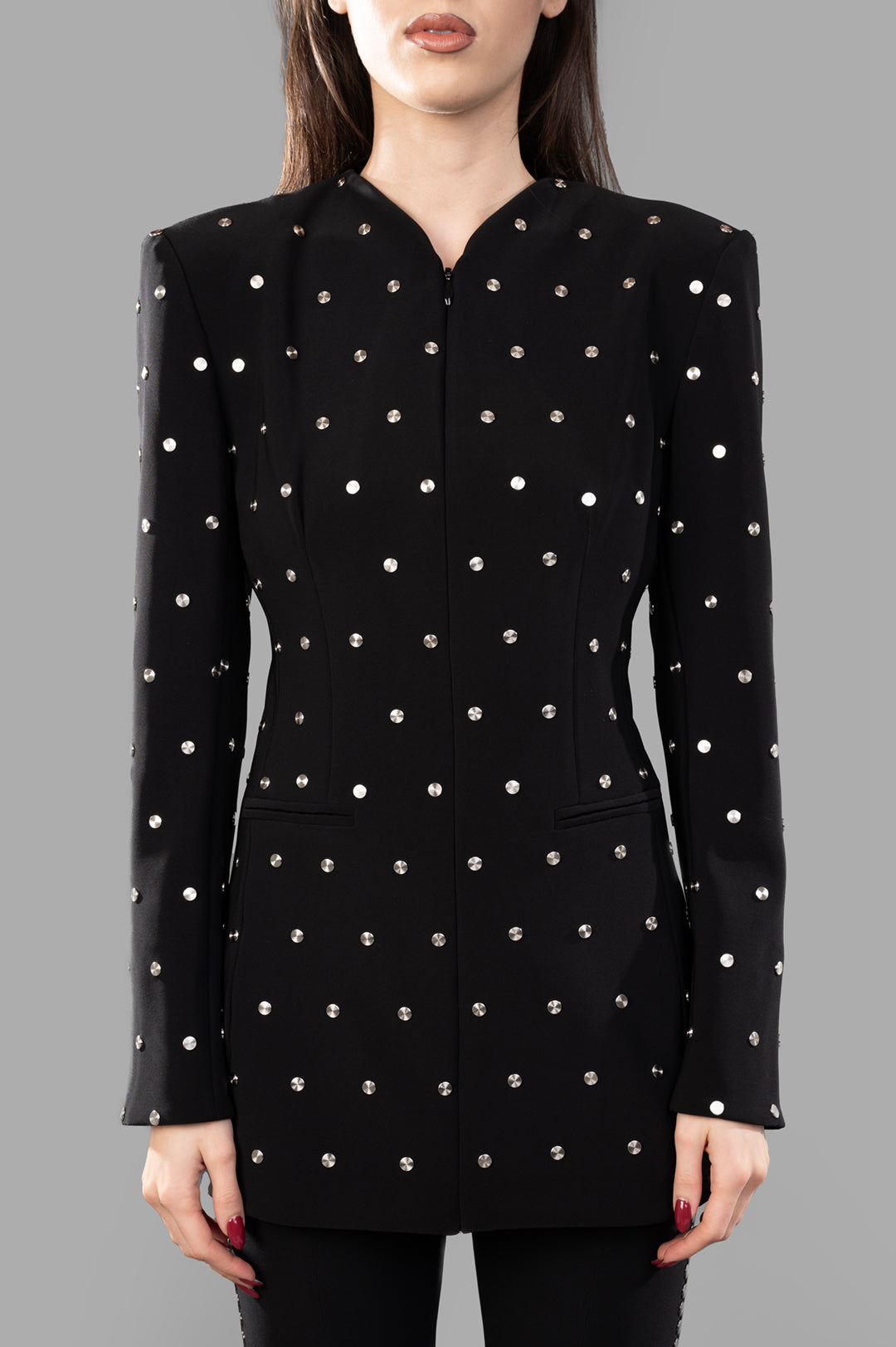 Norma Kamali Shoulder Pad Studded Jacket in black, featuring a fitted silhouette with striking stud embellishments and.