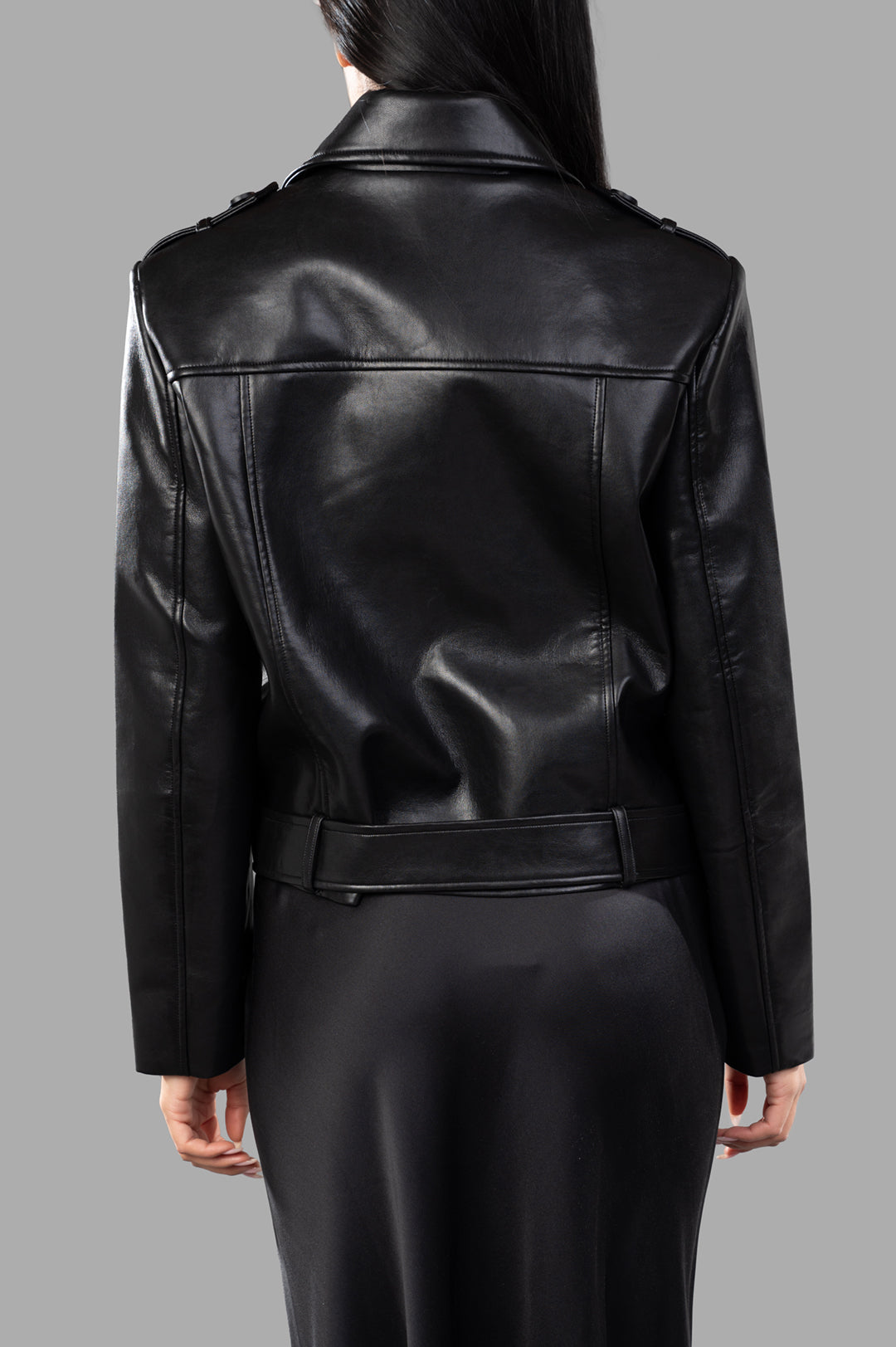 Anine Bing Greer Jacket seen from the back, featuring structured leather, cinched waist, and adjustable belt accents.