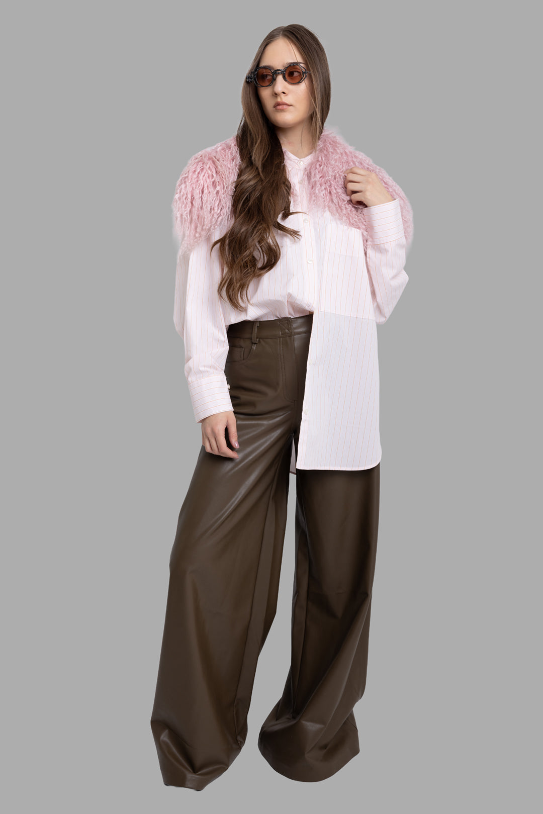 Norma Kamali women's bark vegan leather wide-leg pants, on-model full length, high waist and pooling hem.