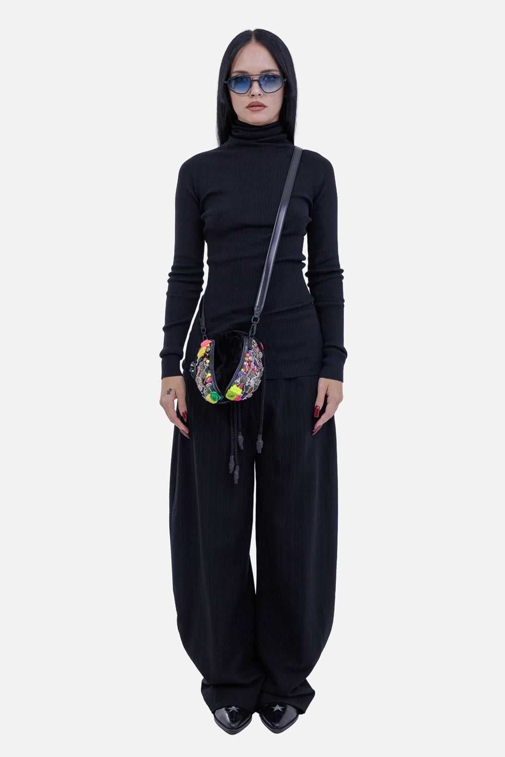 Gentryportofino women's black wide-leg trousers, on-model view with fluid volume and softly tapered hems
