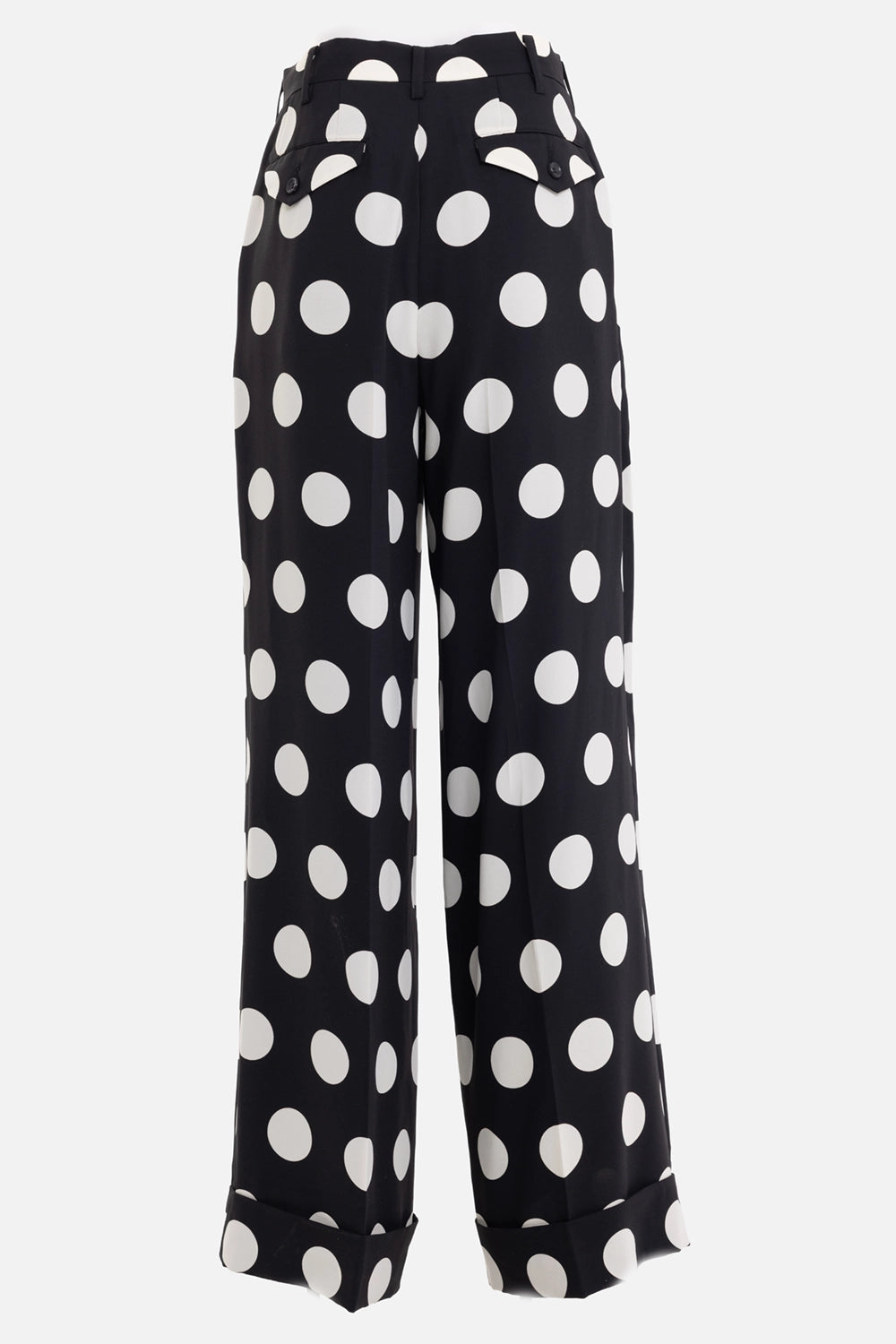 Junya Watanabe women's wide-leg trousers in black and white polka dot, back view, buttoned flap pockets