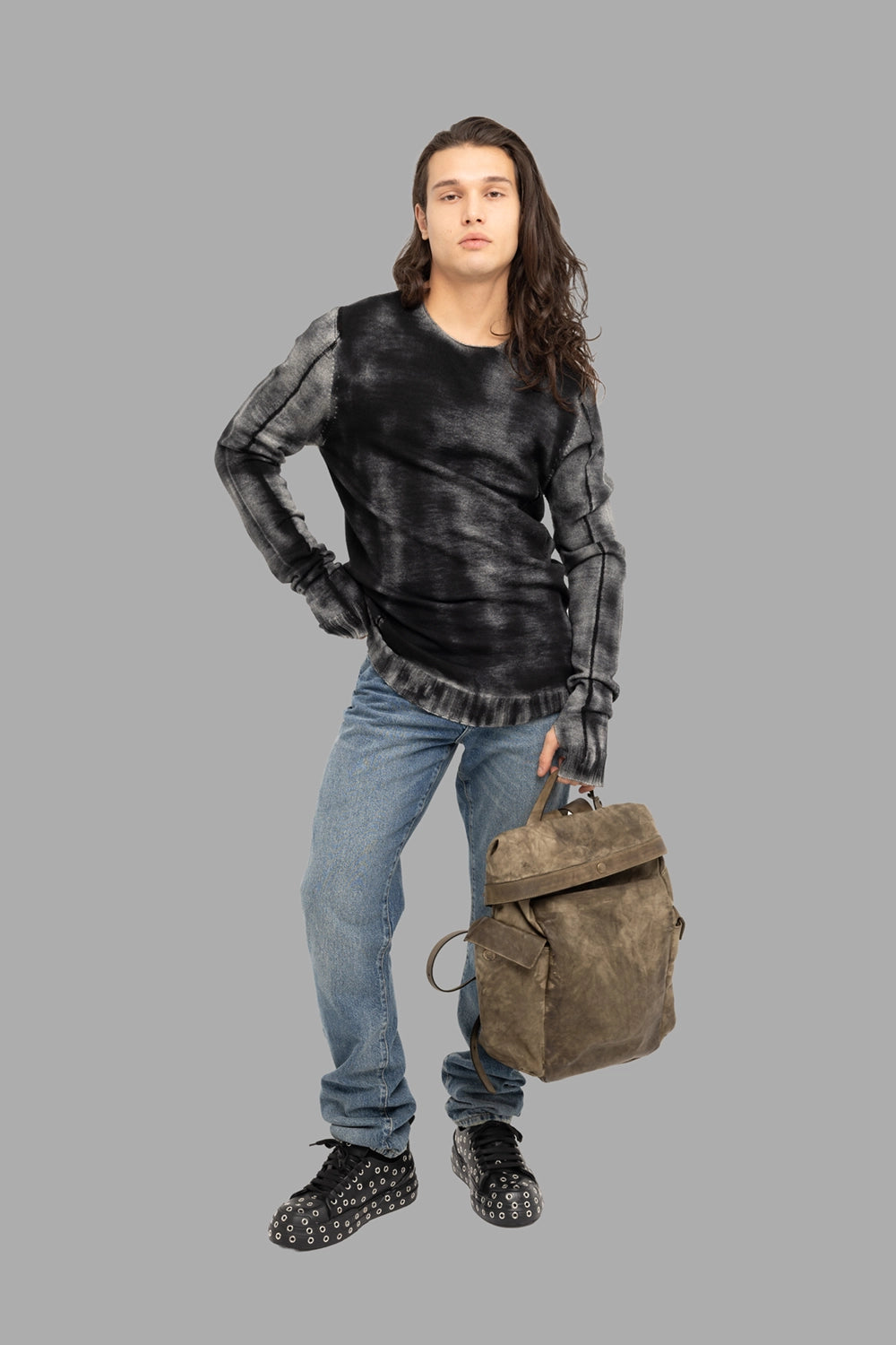 MD75 men’s wool crewneck sweater in black spray, on-model full length, spray-dyed finish and longline hem.