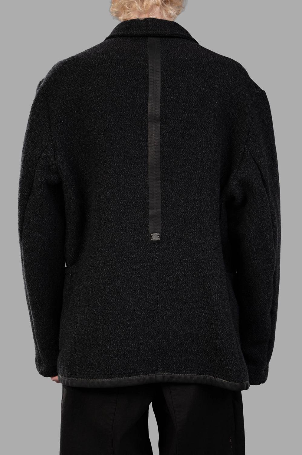 69 by Isaac Sellam worker jacket in Unique, back view, long leather spine with staple detail