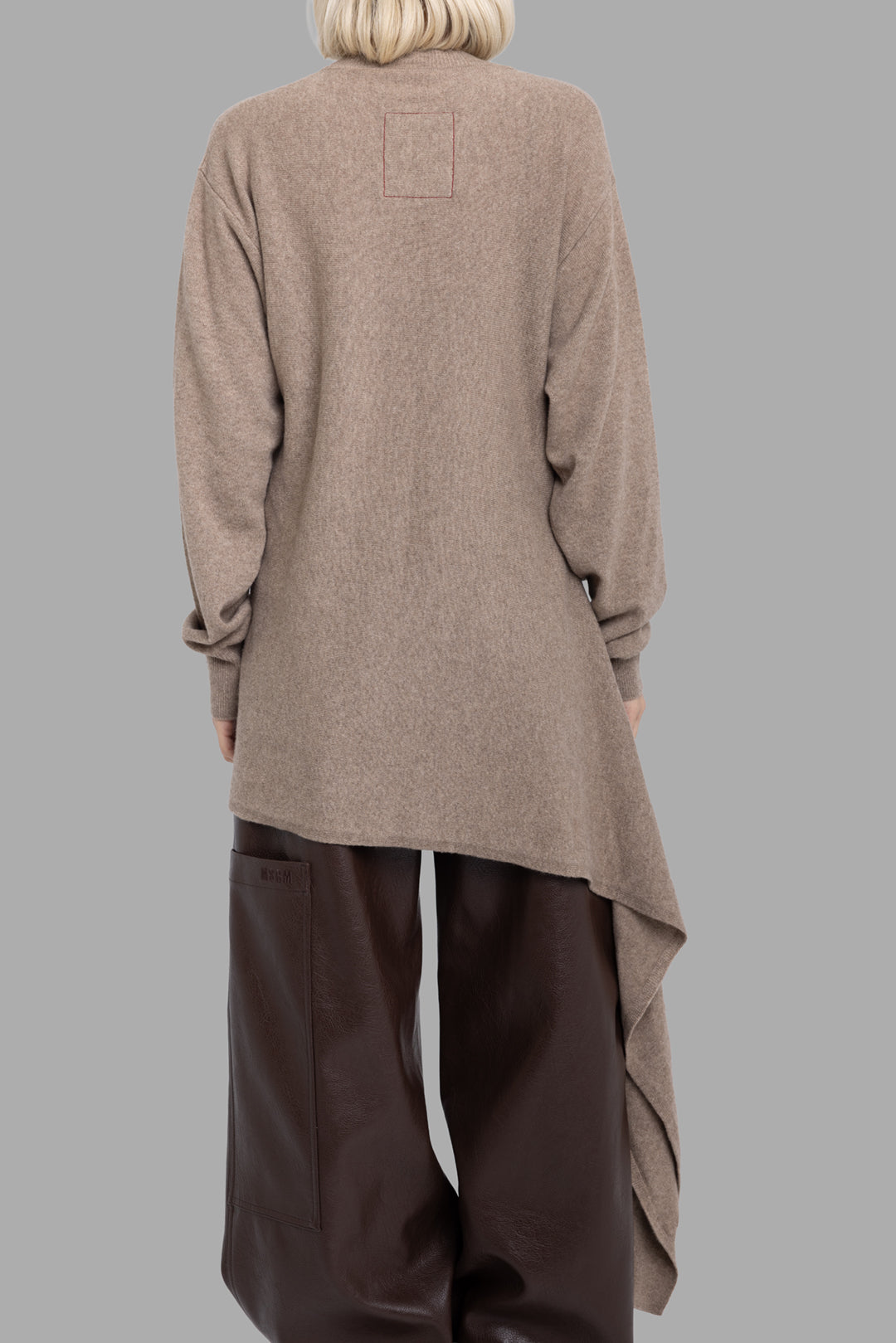 Uma Wang women's tan cashmere wrap top, back view with extended asymmetric hem and contrast red square stitching